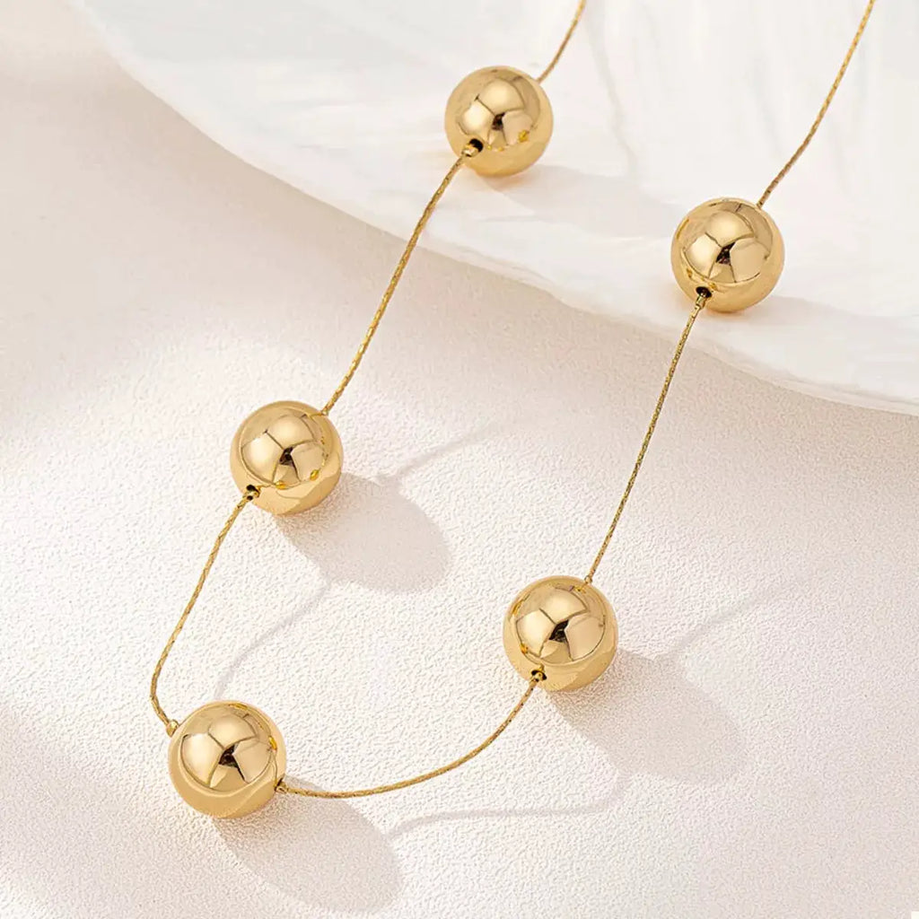 Golden Sphere Statement Necklace by Trendsi