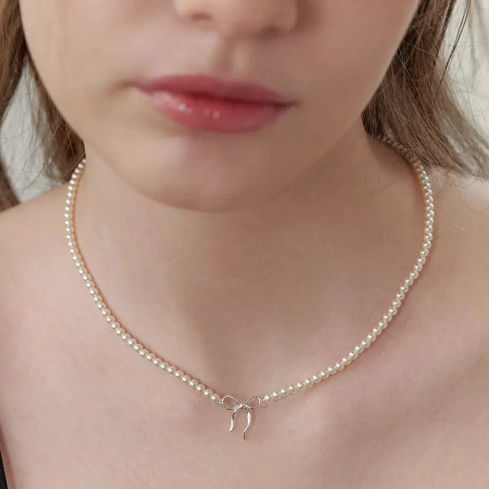 Copper Pearls Bow Necklace by Trendsi