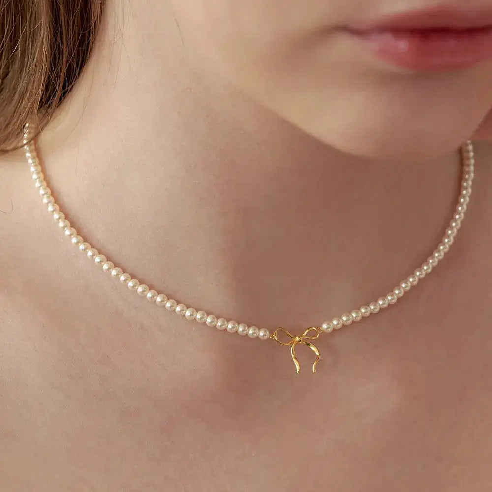 Copper Pearls Bow Necklace by Trendsi