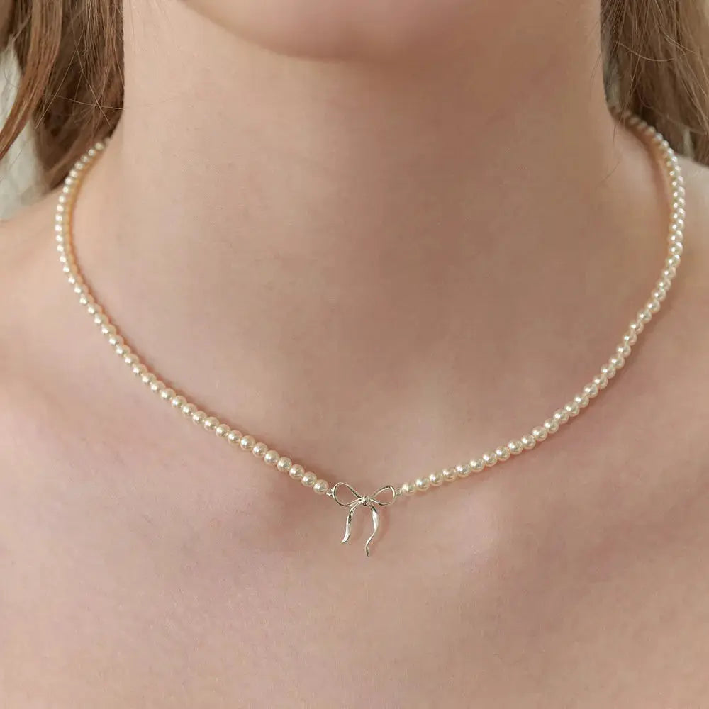 Copper Pearls Bow Necklace by Trendsi