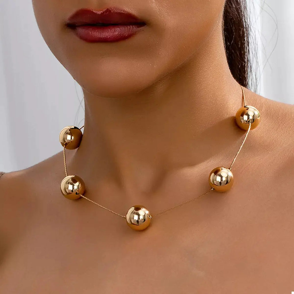 Golden Sphere Statement Necklace by Trendsi