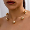 Golden Sphere Statement Necklace by Trendsi