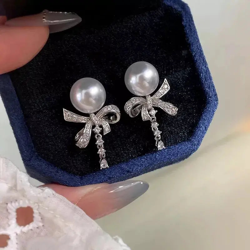 Pearl & Bow Drop Earrings by Trendsi
