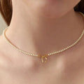 Copper Pearls Bow Necklace by Trendsi