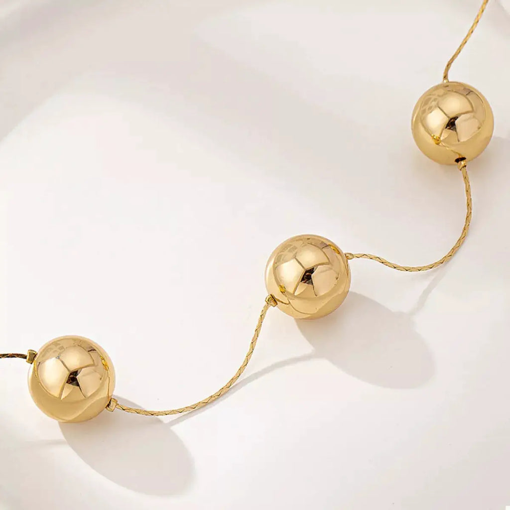 Golden Sphere Statement Necklace by Trendsi