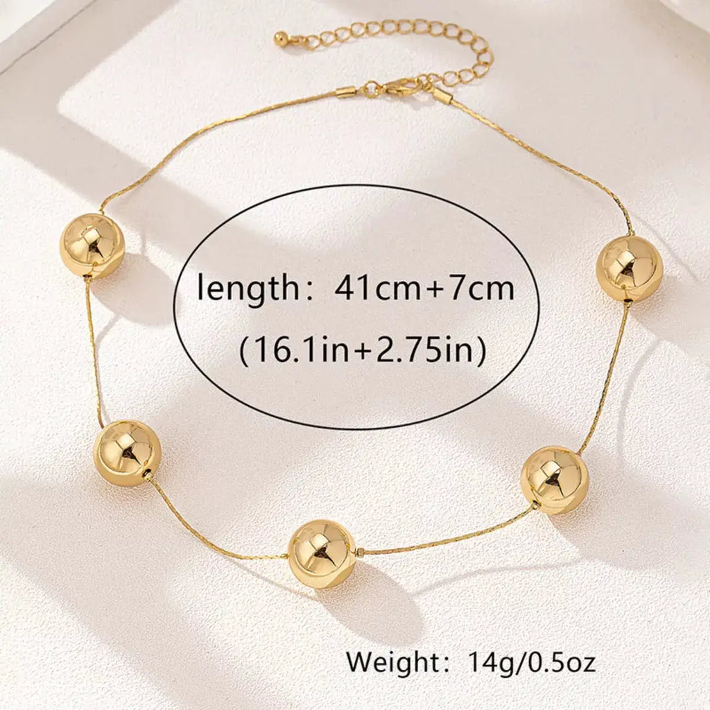 Golden Sphere Statement Necklace by Trendsi