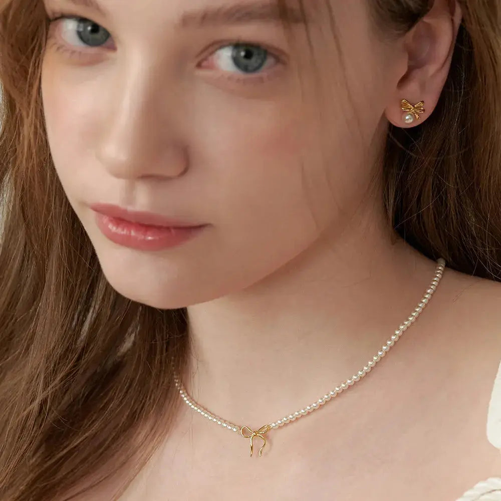 Copper Pearls Bow Necklace by Trendsi