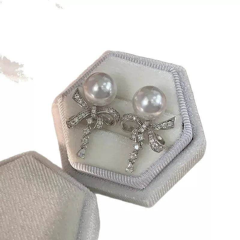 Pearl & Bow Drop Earrings by Trendsi
