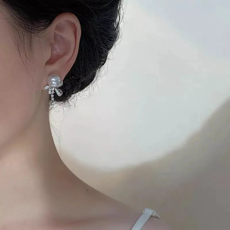 Pearl & Bow Drop Earrings by Trendsi